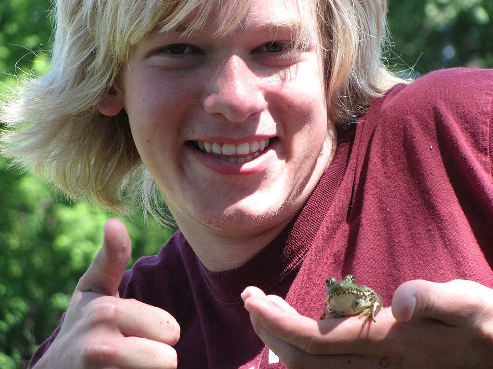 Teen Holding Frog